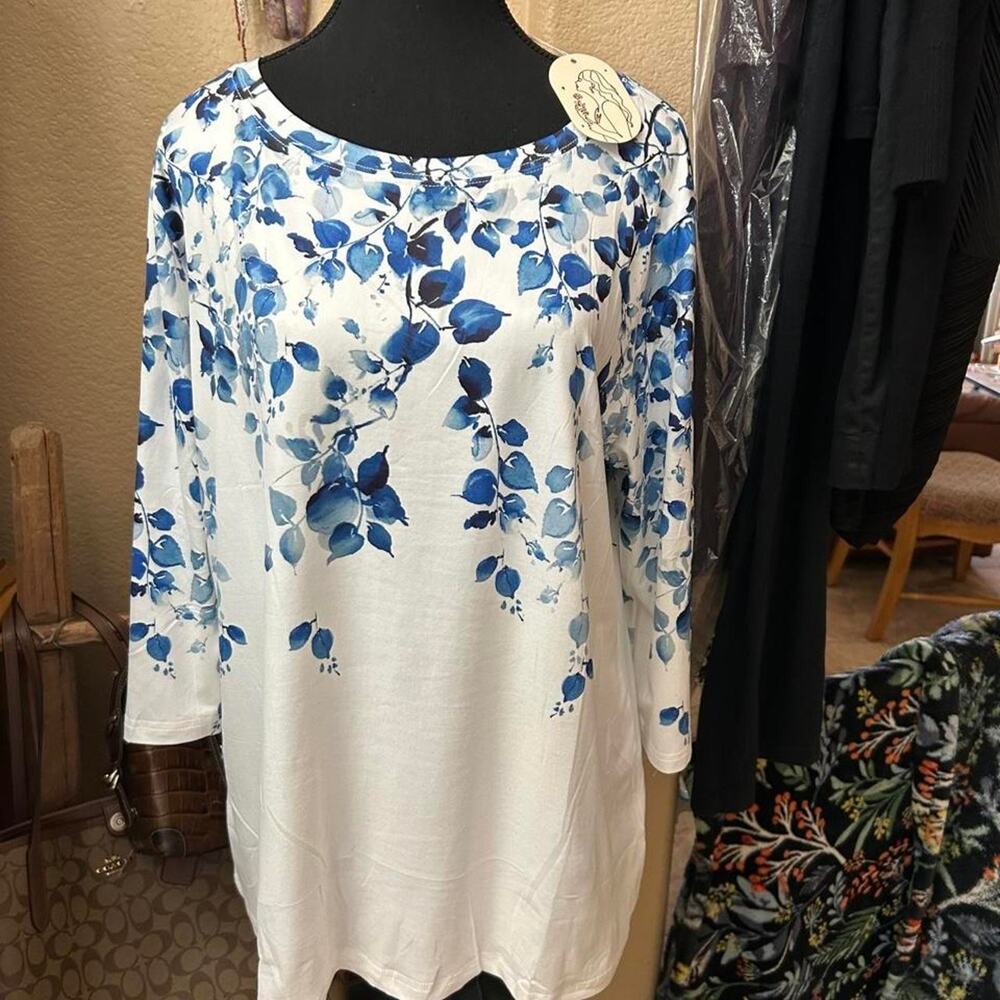 White blouse with blue leaf